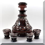 G87. Amethyst glass with silver overlay decanter and 4 cordial glasses. Decanter: 9”h - $58 